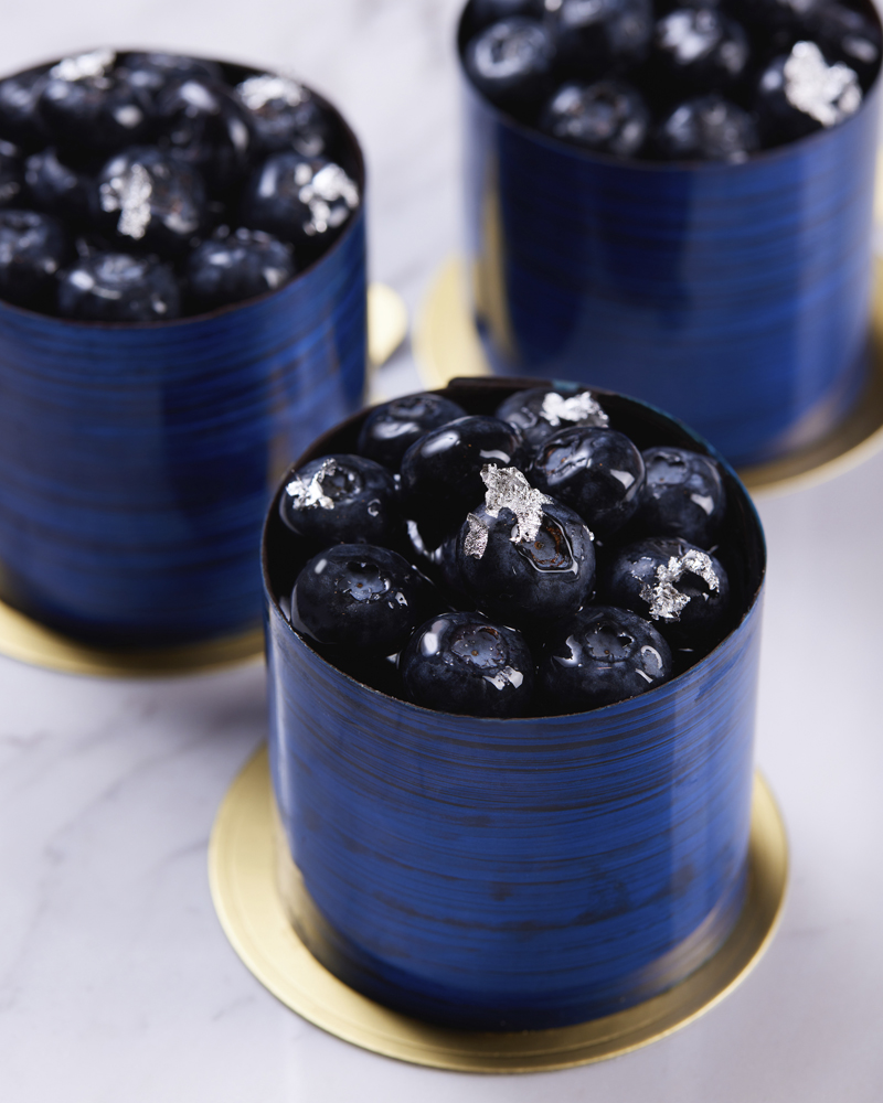 A blueberry cheesecake from SAVVY's afternoon tea menu. Blueberry cheesecake made from Australian cheese, blends with blueberry compote and cinnamon filling, top with a silver leaf and sprinkling of blueberries